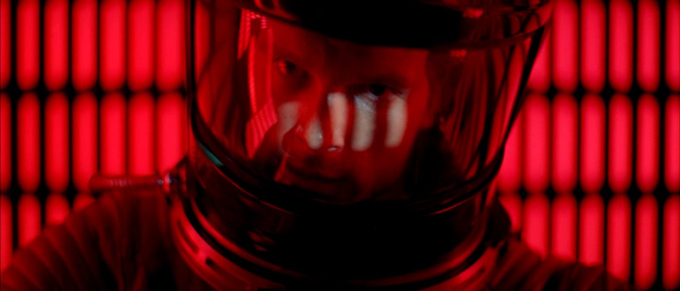 A scene from 2001 a space odyssey - close up of astronaught in a suit in a computer suite.